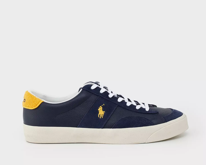 Polo Ralph Lauren Sayer Leather-Suede sneakers in navy blue with yellow accents, white laces, and a textured sole, side view.