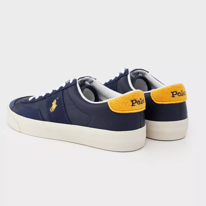 Polo Ralph Lauren Sayer Leather-Suede sneakers in navy blue with yellow accent, textured leather and suede details, back angle showing heel design.