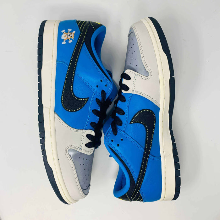 Nike SB Dunk Low Instant Skateboards sneaker in blue and gray with Nike swoosh and Instant Skateboards logo.