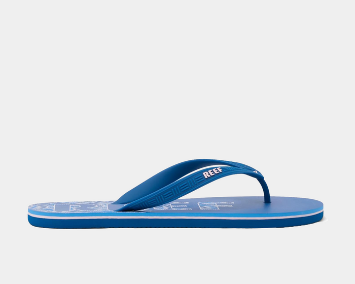 Reef Seaside Prints flip flops in blue with printed footbed and textured strap, side view.