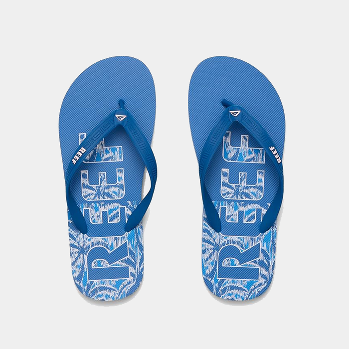 Reef Seaside Prints sandals in blue with palm tree graphics and logo design, top view.