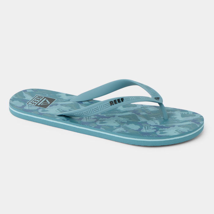 Reef Seaside Prints flip-flops in blue with camo pattern and branded straps, side angle.