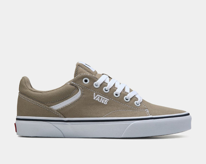 Vans Seldan sneakers in beige canvas with white laces, side stripe detail, and durable white rubber outsole, side view.