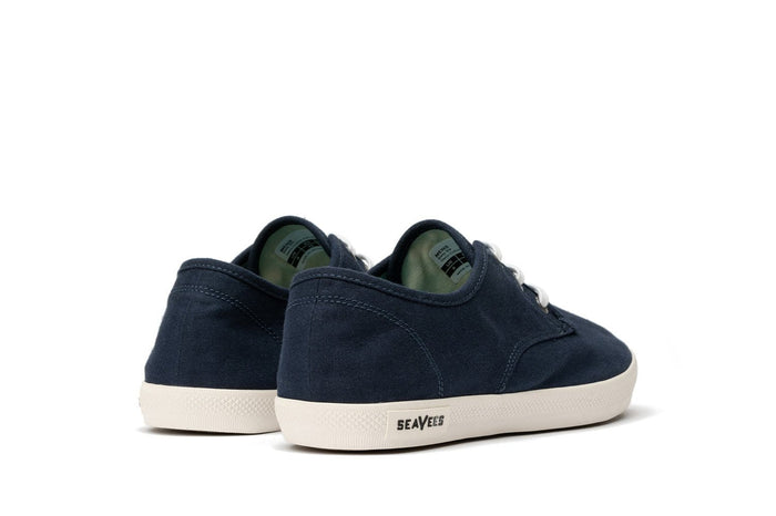 SeaVees Sixty Six sneakers in navy canvas with white rubber outsole and lace-up design, back angle view.
