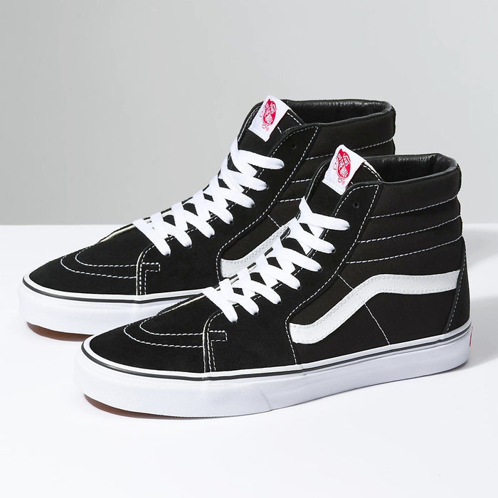 Vans Sk8-Hi sneakers in black suede and canvas with white side stripe, white laces, and vulcanized rubber outsole, side view.