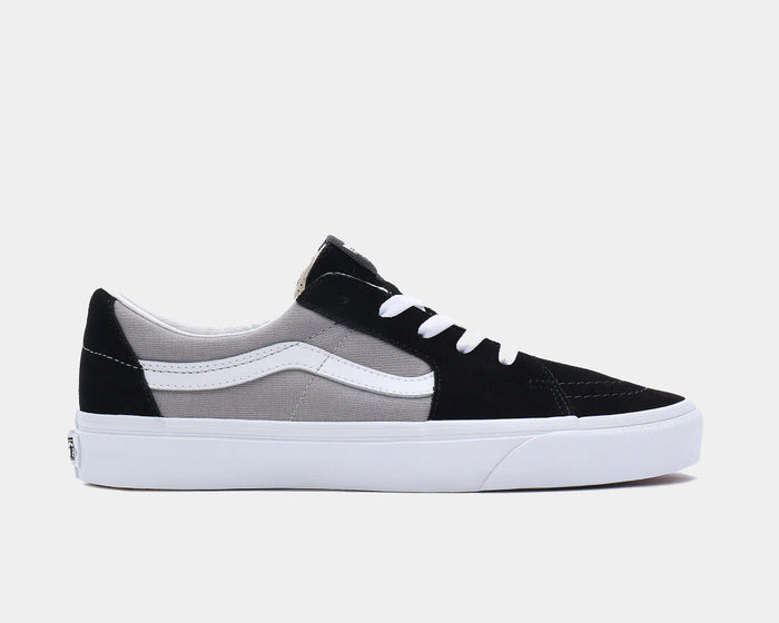 Vans Sk8-Low sneakers in black, gray, and white with suede upper, canvas panels, signature side stripe, and white rubber sole, side view.