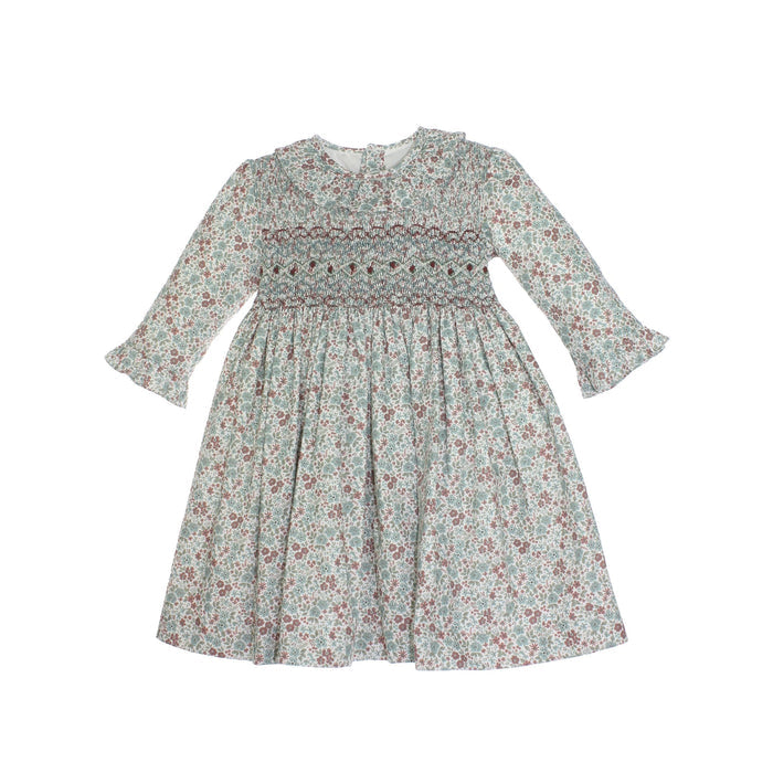 Floral dress with smocked bodice on a white background