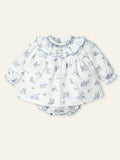 Baby dress with floral pattern on a white background