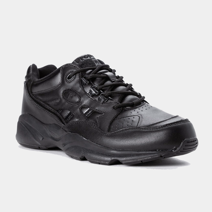 Propét Stability Walker walking shoes in black leather with perforated details and padded collar, angled front-side view.