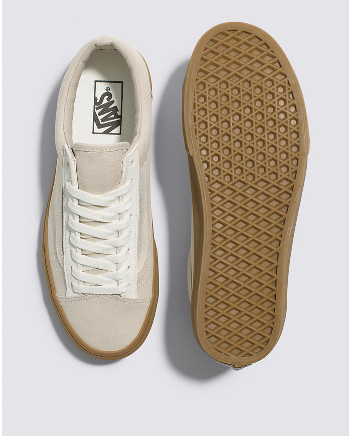 Vans Style 36 sneakers in cream with white laces and gum rubber outsole, top and sole views showing canvas upper and waffle tread.
