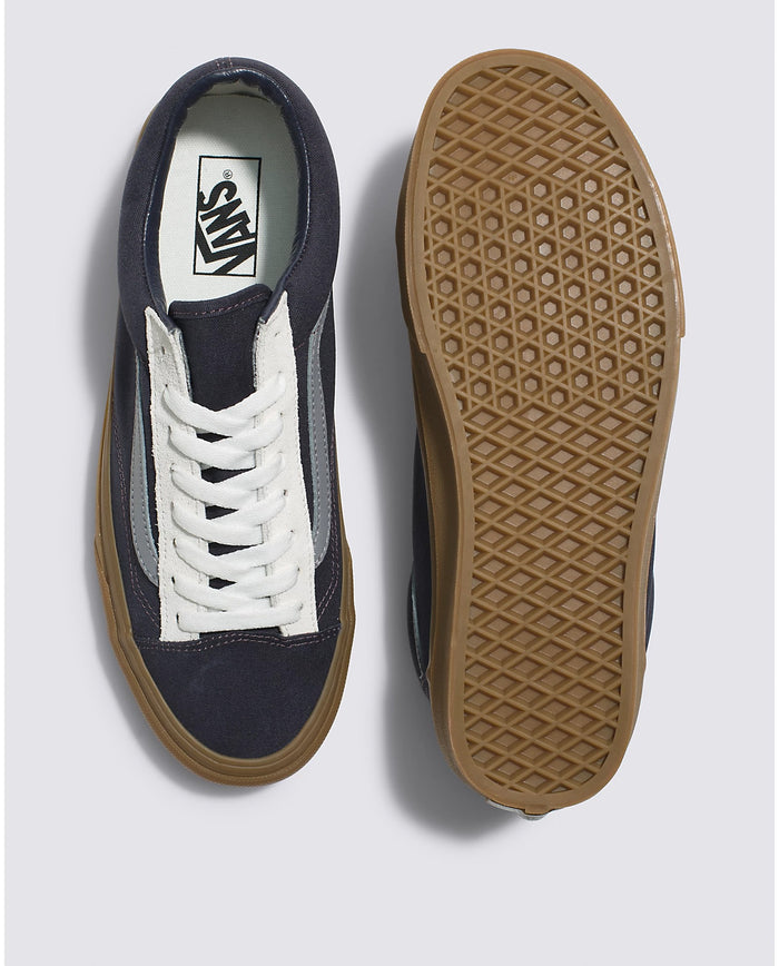 Vans Style 36 sneakers top and sole view featuring navy canvas upper, white suede detailing, lace-up design, and gum outsole.