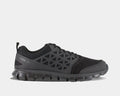 Reebok Work Sublite Cushion Work Soft Toe work shoes in black with mesh upper and geometric overlays, side view.