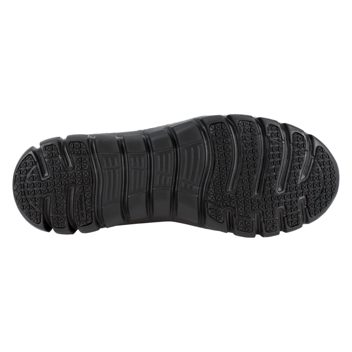 Reebok Work Sublite Cushion Work Soft Toe outsole in black, showing slip-resistant tread pattern and flex grooves.
