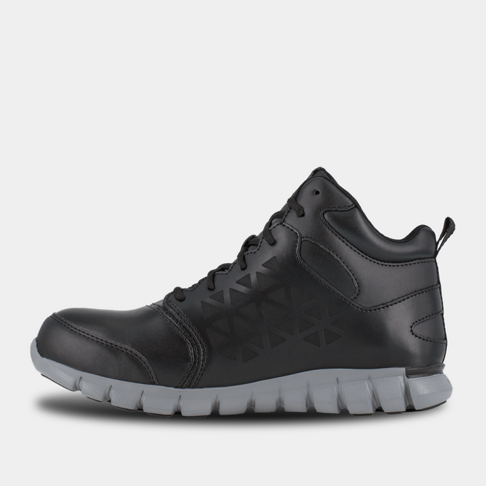 Reebok Work Sublite Cushion Work shoes in black leather with geometric side panel design and gray cushioned outsole, side view.