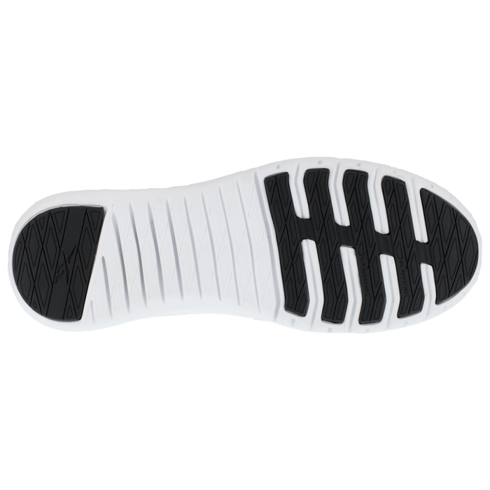 Reebok Work Sublite Legend Work shoe outsole in black and white rubber with flex grooves, bottom view.
