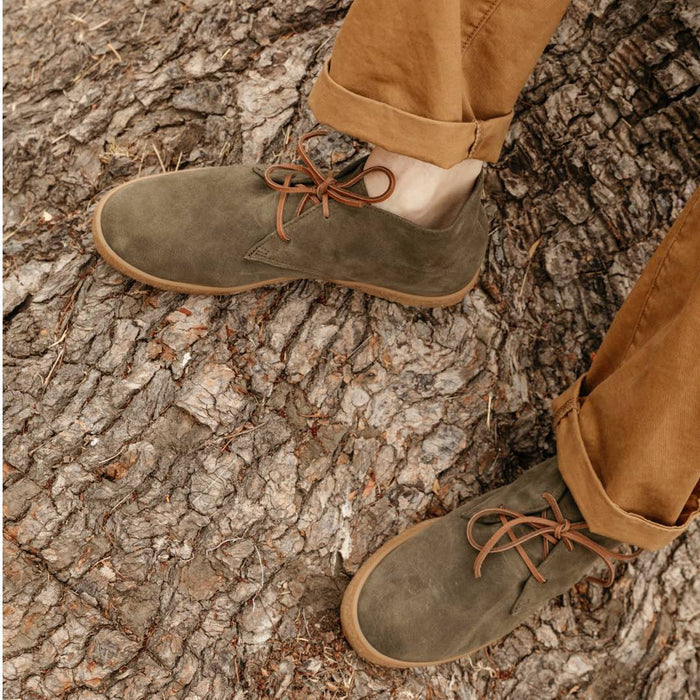 SeaVees Sun-Tans Chukka shoes in olive green suede with brown laces and gum sole, worn outdoors on tree bark.