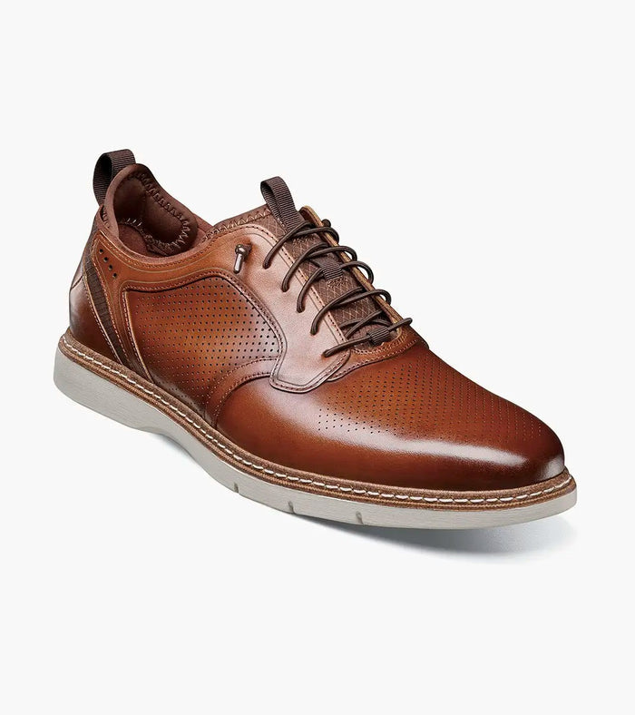 Stacy Adams Sync Plain Toe dress shoes in cognac brown leather with perforated detailing and contrast sole, side angle view.