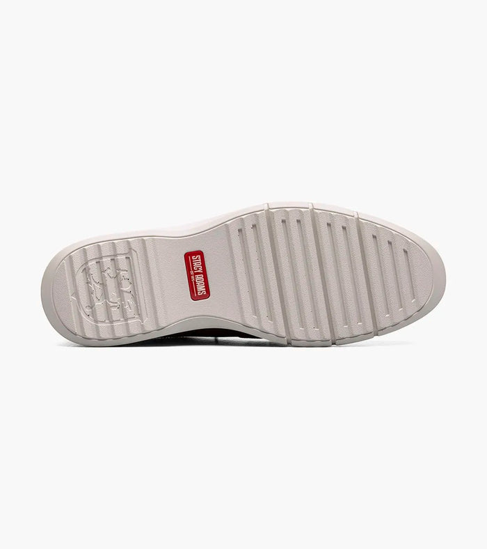 Stacy Adams Sync Plain Toe shoe sole in white rubber with textured grooves and red brand logo, bottom view.