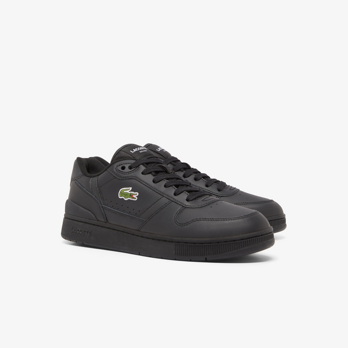 Lacoste T-Clip Set 224 2 SMA sneakers in black leather with embroidered logo, perforated detailing, and black rubber outsole, front angled view.