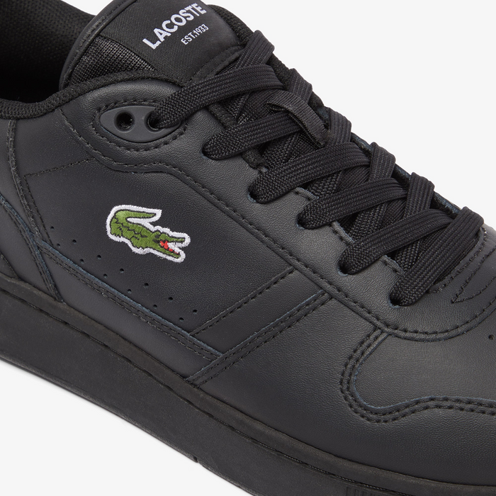 Lacoste T-Clip Set 224 2 SMA sneakers in black synthetic leather with embroidered crocodile logo and black laces, side view.