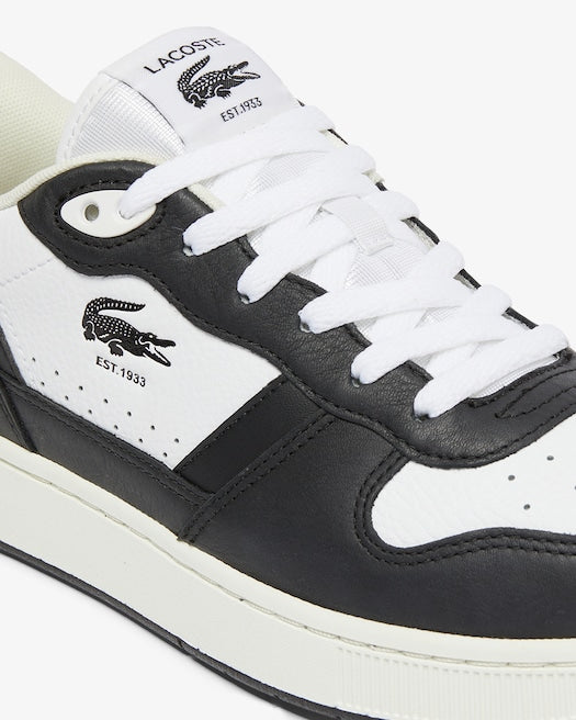 Lacoste T-Clip Set Leather Sneakers in black and white, featuring leather overlays, embossed logo, and lace-up closure, side view.