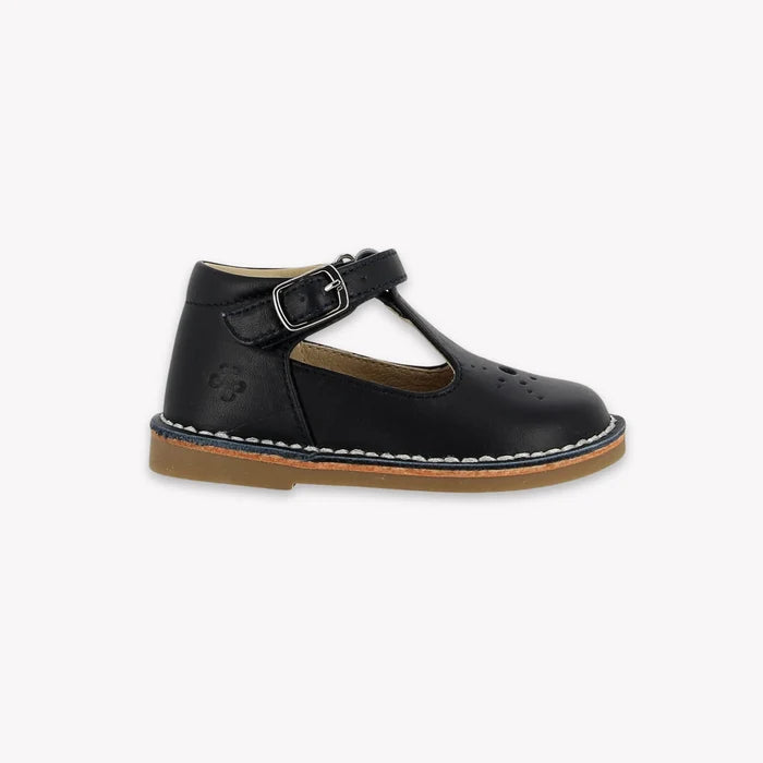 Navy leather shoe with a buckle on a white background