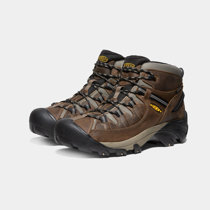 Keen Targhee II Mid hiking boots in brown leather with black rubber toe caps and rugged outsole, angled front-side view.
