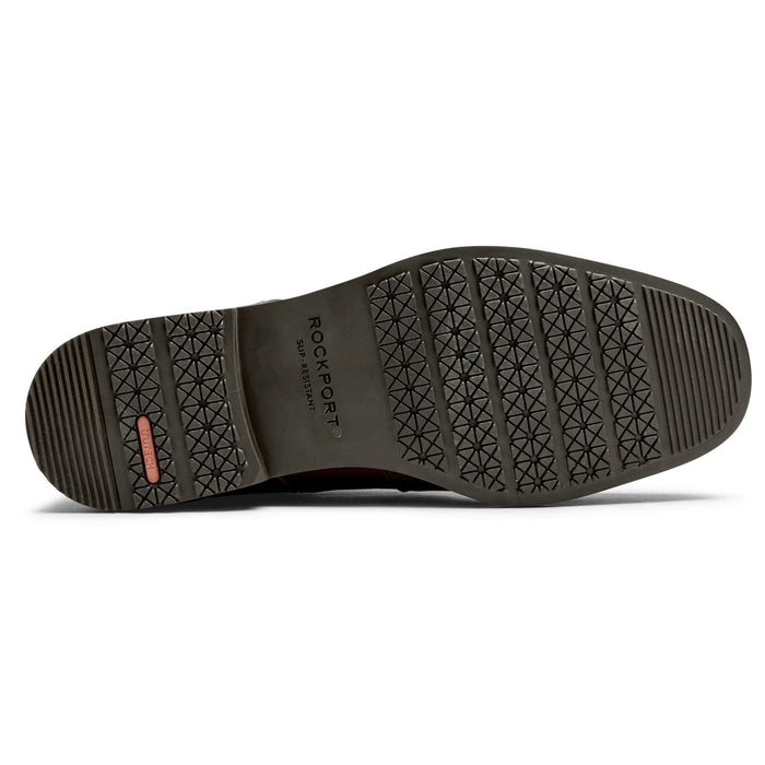 Rockport Taylor Cap Toe shoe sole with slip-resistant tread pattern in black rubber, bottom view.