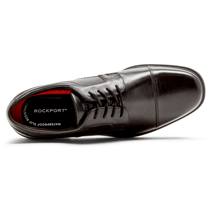 Rockport Taylor Cap Toe dress shoe in black leather with sleek lace design and cushioned insole, top view.