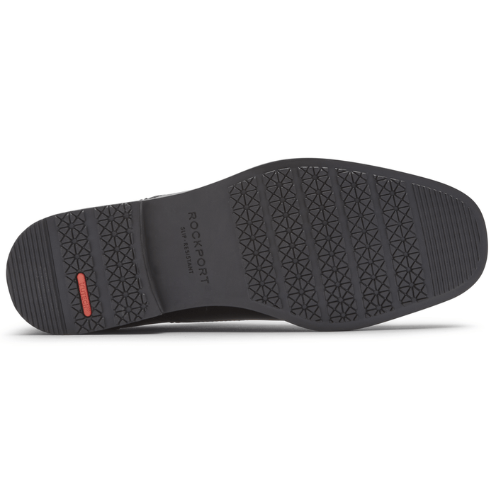Rockport Taylor Slip On shoe outsole with slip-resistant black rubber and textured tread pattern, sole/bottom view.