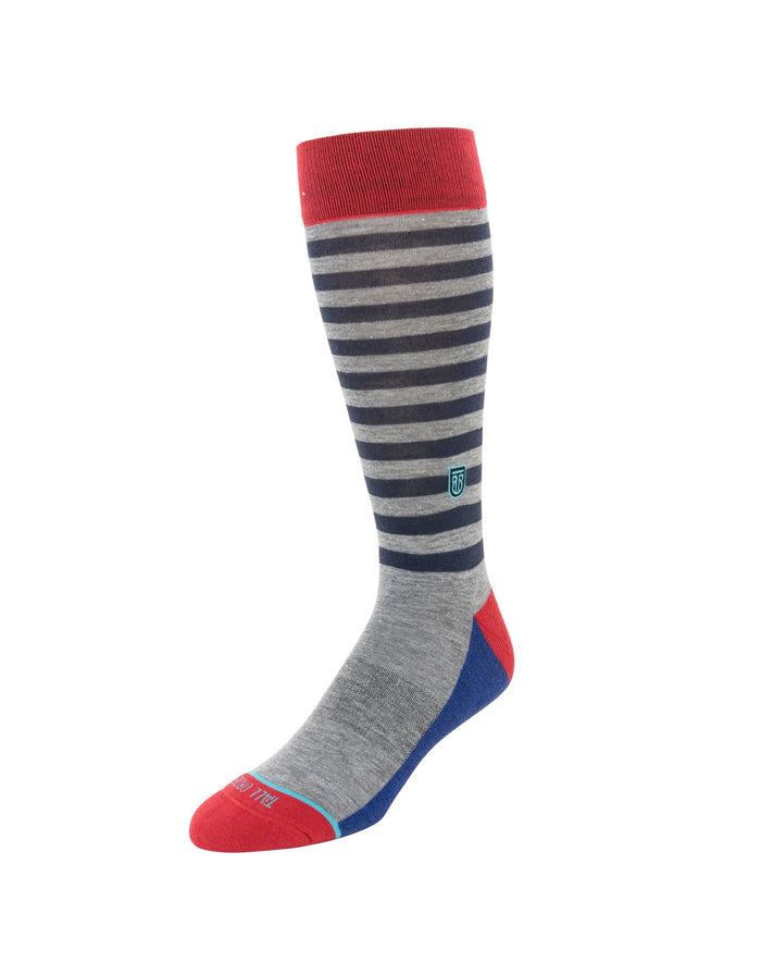 Tall Order The Stripes Extra Cushioned socks in gray with navy stripes, red cuff and toe, and blue heel, side view.