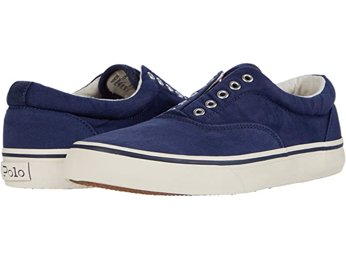 Polo Ralph Lauren Thorton V sneakers in navy blue canvas with metal eyelets, white rubber midsole and Polo branding, angled side view.