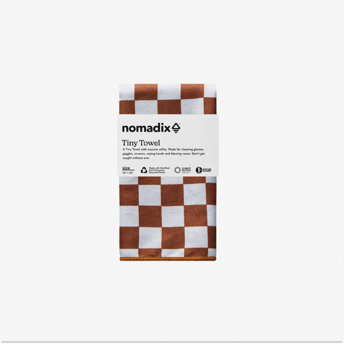 Nomadix Tiny Towel in brown and white checkered pattern, made with certified recycled materials, folded front view.