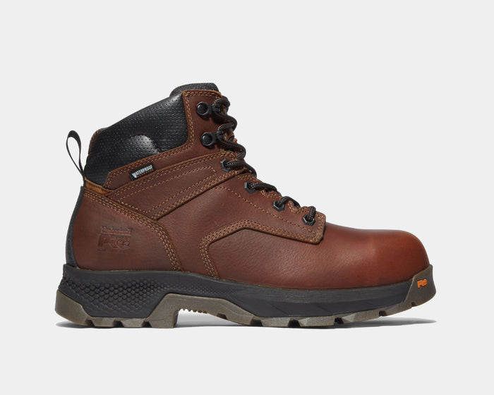 Timberland Pro Titan EV 6" Waterproof Composite Toe Boot in brown leather with black padded collar and rugged outsole, side view.