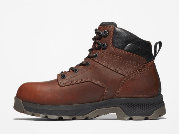 Timberland Pro Titan EV 6" Waterproof Composite Toe Boot in brown leather with black padded collar, side view showing rugged outsole and lace-up design.