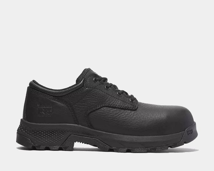 Timberland Pro TiTAN EV Composite Toe Oxford work shoes in black leather with rugged outsole and reinforced toe, side view.