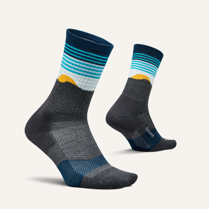 Feetures Trail Max Cushion Mini Crew Sock featuring gray base, blue and white striped cuff with yellow accents, side view.