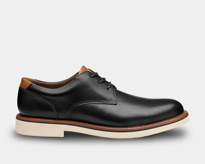 Johnston & Murphy Tyson Plain Toe shoes in black leather with tan accents and white ribbed sole, side view.