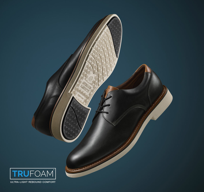 Johnston & Murphy Tyson Plain Toe dress shoes in black leather with tan accents, featuring TruFoam soles, angled side and sole view.
