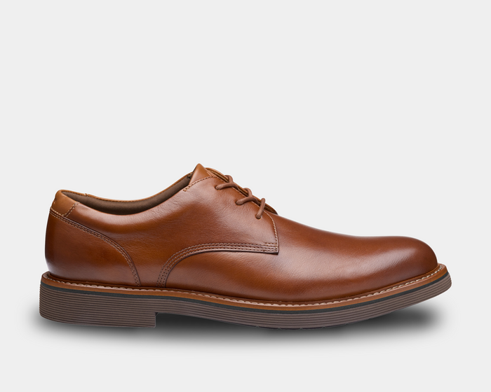 "Johnston & Murphy Tyson Plain Toe shoes in tan leather with lace-up design and stacked rubber sole, side view"