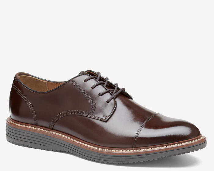 Johnston & Murphy Upton Cap Toe dress shoes in polished brown leather with contrast stitching and rubber sole, side view.