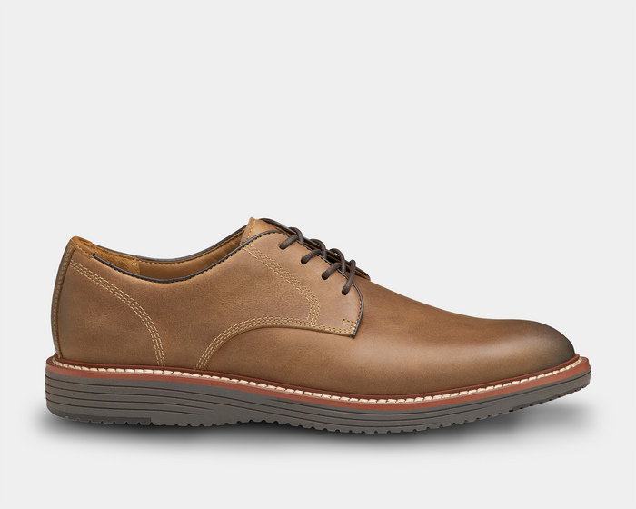Johnston & Murphy Upton Plain Toe dress shoes in tan leather with contrast stitching and textured rubber outsole, side view.
