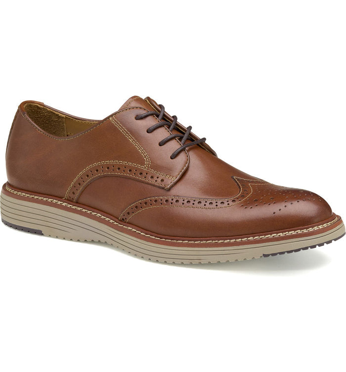 Johnston & Murphy Upton Wingtip shoe in tan leather with brogue detailing, cushioned sole, and lace-up design, side view.