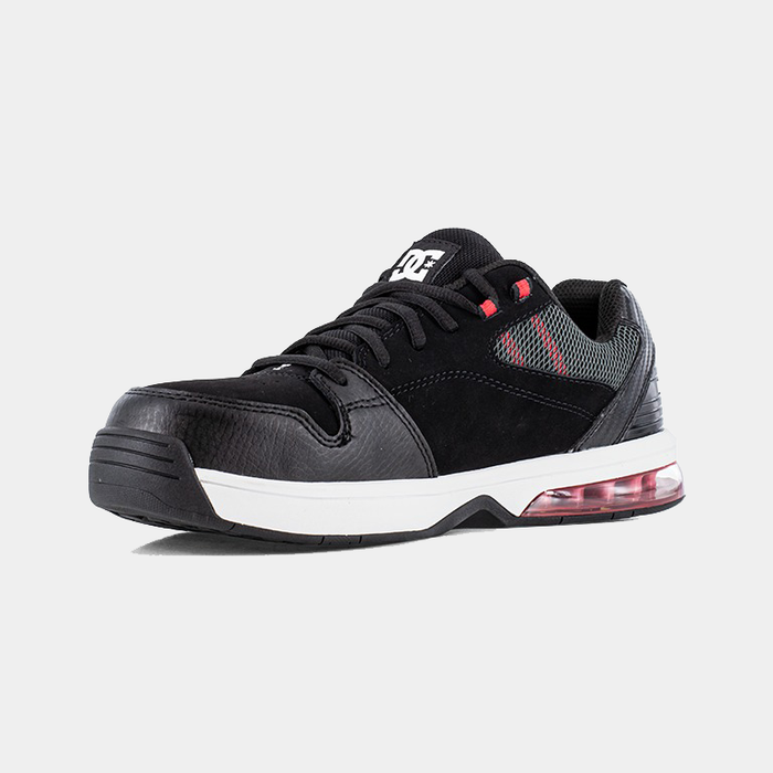 DC WorkCrew Versatile Work Comp Toe work shoes in black with composite toe, mesh accents, and cushioned white midsole, angled front view.
