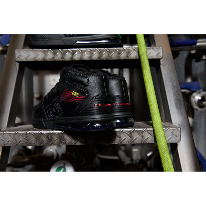 DC WorkCrew Versatile Work Hi Top Comp Toe work shoes in black with red mesh accents and composite toe, back view.