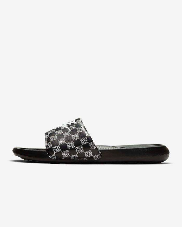 Nike Victori One Printed slides with black and white checkered strap and cushioned black sole, side view.