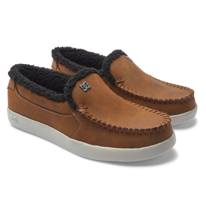 DC Footwear Villain 2 SE slip-on shoes in brown leather with moc-toe stitching, fleece lining, and white rubber outsole, angled view.