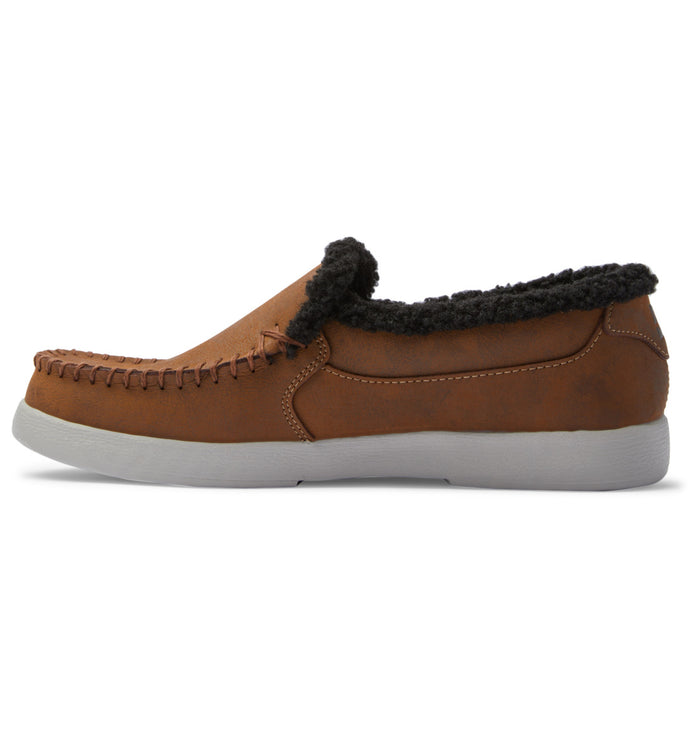 DC Footwear Villain 2 SE slip-on shoes in brown with moccasin-style stitching, black fleece lining, and white outsole, side view.