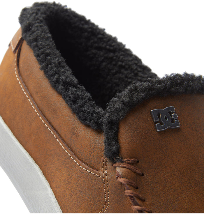 DC Footwear Villain 2 SE slip-on shoes in brown with black fleece lining, stitched details, and logo accent, side view.