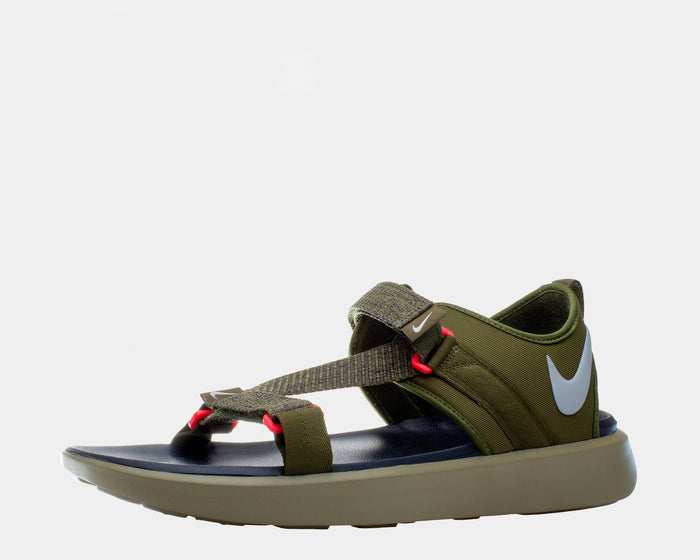 Nike Vista sandals in olive green with adjustable straps, red accents, and white logo on the side, side view.